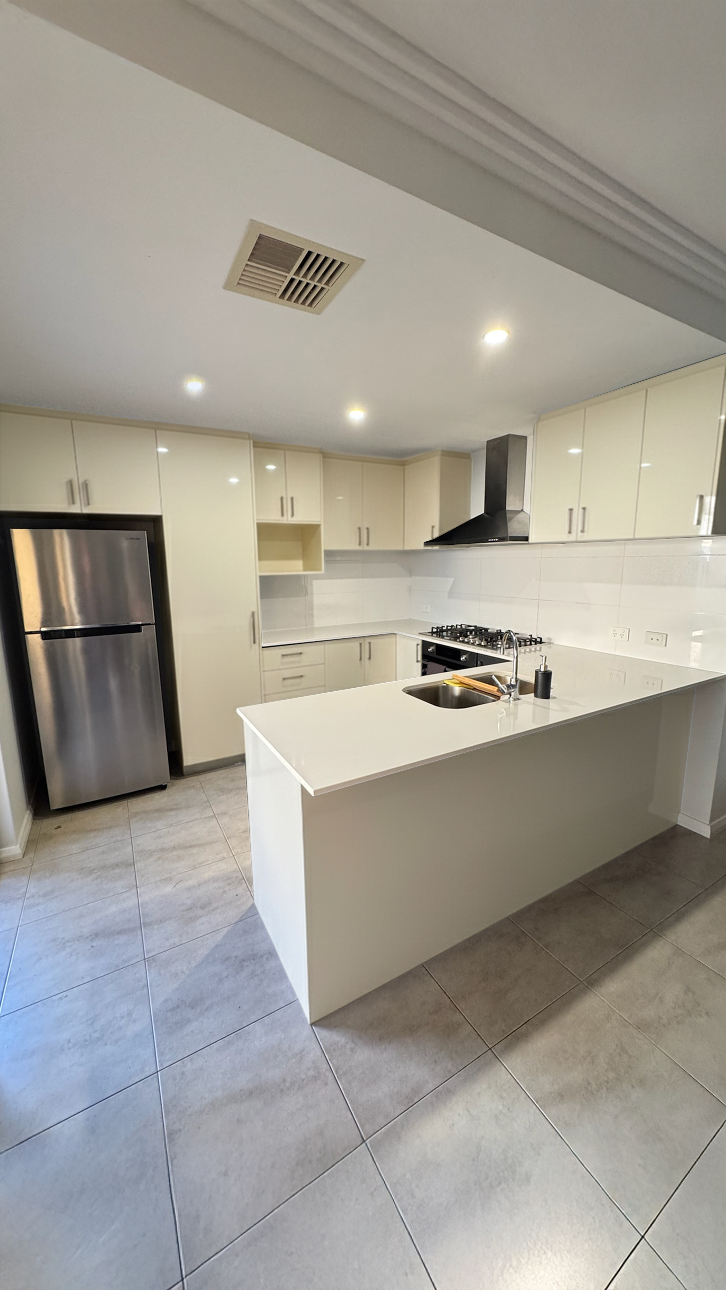 Cream gloss cabinets refreshed in matte black before