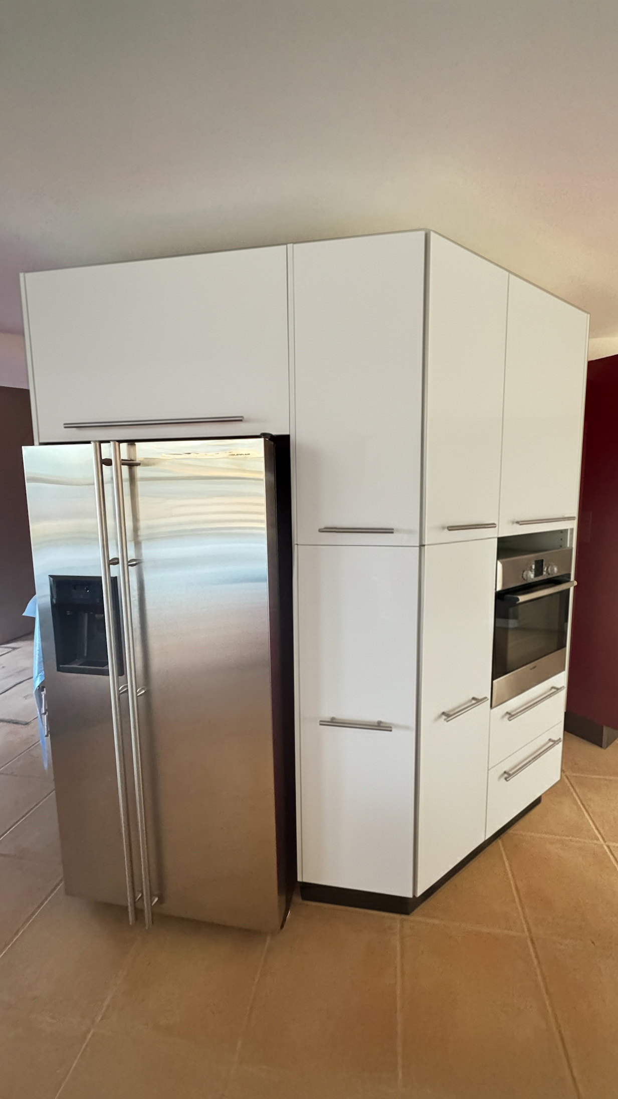 High-gloss red pantry taken back to crisp white after
